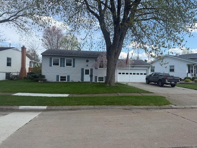 2208 S Oldgate Rd, Sandusky, OH 44870 - split foyer home featuring driveway, a front yard, and a garage