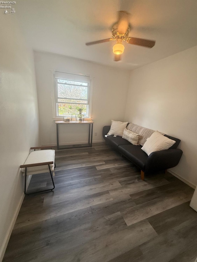 2208 S Oldgate Rd, Sandusky, OH 44870 - sitting room featuring baseboards, a ceiling fan, and dark wood-type flooring