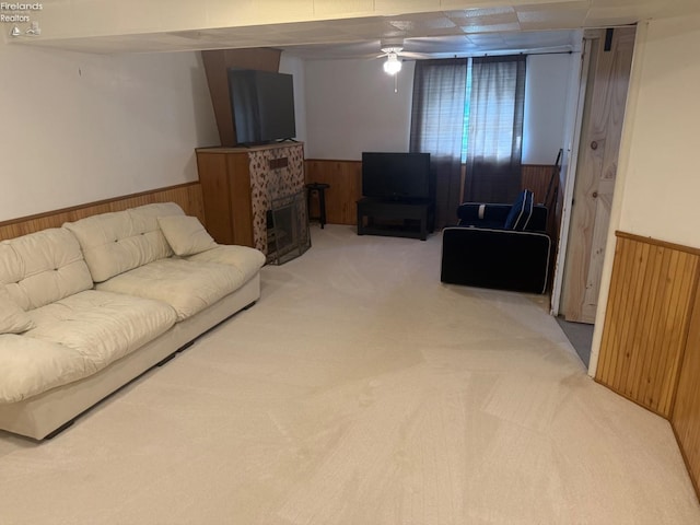2208 S Oldgate Rd, Sandusky, OH 44870 - living area with wainscoting, ceiling fan, wood walls, and carpet floors