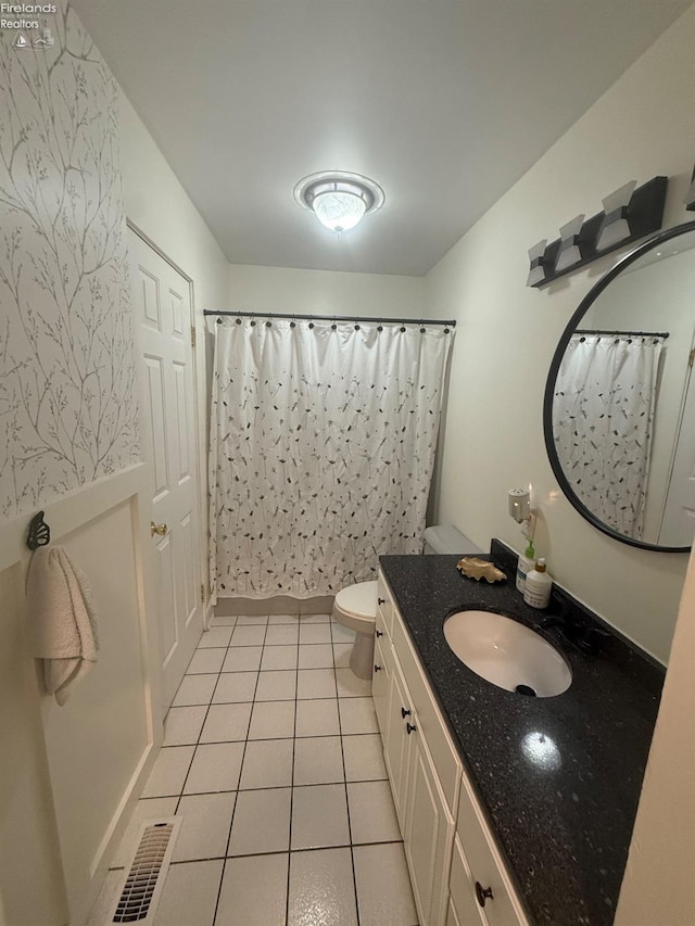 2208 S Oldgate Rd, Sandusky, OH 44870 - bathroom with tile patterned flooring, visible vents, toilet, vanity, and a shower with shower curtain