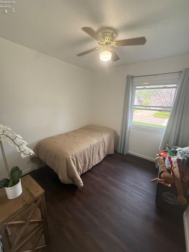 2208 S Oldgate Rd, Sandusky, OH 44870 - bedroom featuring visible vents, baseboards, dark wood-style floors, and ceiling fan