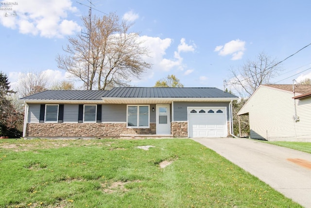 624 Shumaker Dr, Bellevue, OH 44811 - ranch-style house featuring a front lawn, concrete driveway, an attached garage, and stone siding