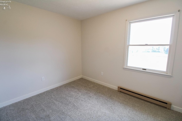 624 Shumaker Dr, Bellevue, OH 44811 - carpeted empty room with baseboard heating and baseboards