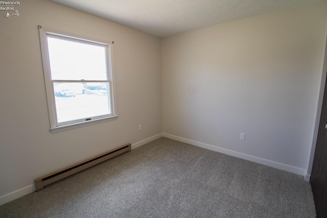 624 Shumaker Dr, Bellevue, OH 44811 - unfurnished room featuring baseboard heating, baseboards, and carpet floors