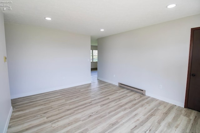 624 Shumaker Dr, Bellevue, OH 44811 - spare room with recessed lighting, baseboard heating, and light wood-style flooring