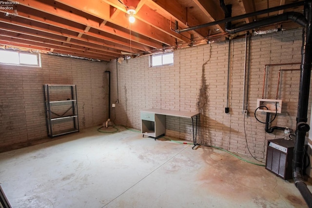 624 Shumaker Dr, Bellevue, OH 44811 - basement with brick wall