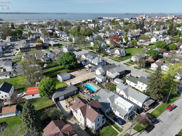 bird's eye view featuring a residential view and a water view