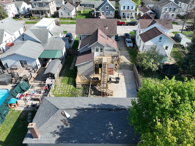 birds eye view of property with a residential view