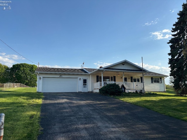 6814 Parker Rd, Castalia, OH 44824 - view of front of property featuring driveway, covered porch, a front yard, and an attached garage