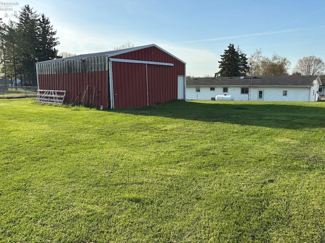 6814 Parker Rd, Castalia, OH 44824 - view of yard featuring a pole building, a garage, and an outbuilding