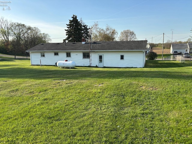 6814 Parker Rd, Castalia, OH 44824 - rear view of house featuring a yard