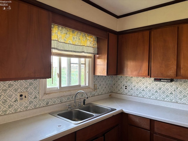 6814 Parker Rd, Castalia, OH 44824 - kitchen with light countertops, backsplash, and a sink