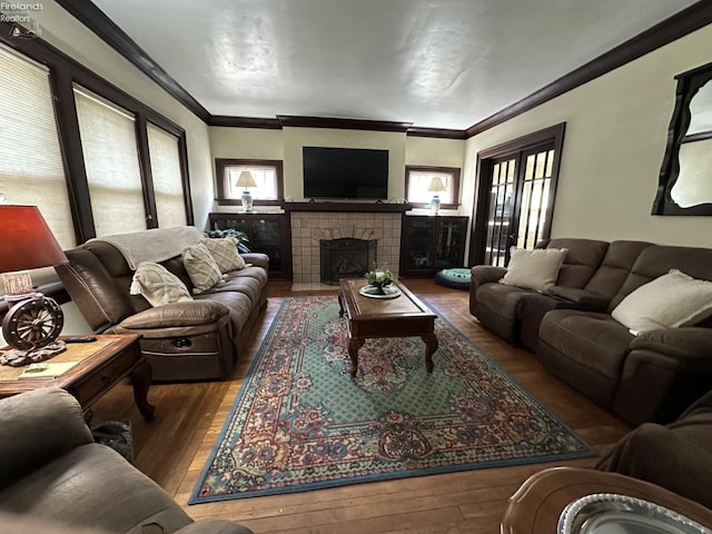 123 E Main, Norwalk, OH 44857 - living room with crown molding, hardwood / wood-style flooring, and a fireplace