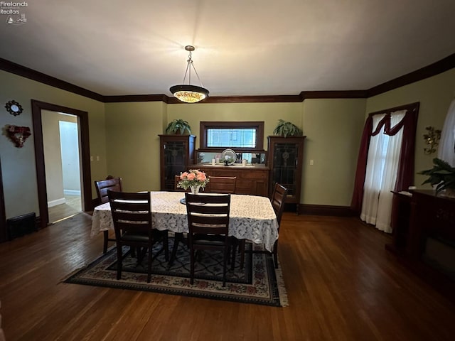123 E Main, Norwalk, OH 44857 - dining area with baseboards, crown molding, and dark wood-type flooring