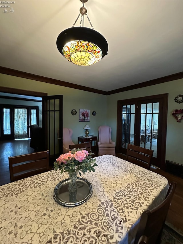 123 E Main, Norwalk, OH 44857 - dining area with wood finished floors, french doors, plenty of natural light, and ornamental molding
