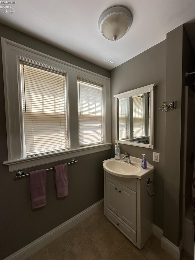 123 E Main, Norwalk, OH 44857 - bathroom featuring tile patterned flooring, vanity, and baseboards