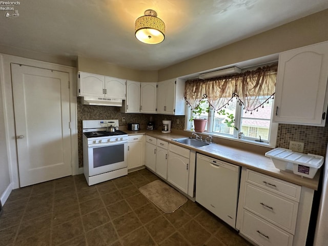 123 E Main, Norwalk, OH 44857 - kitchen with white appliances, under cabinet range hood, backsplash, a sink, and white cabinetry