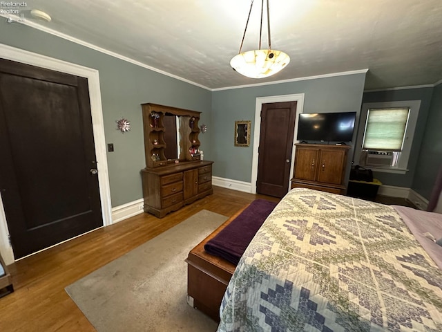 123 E Main, Norwalk, OH 44857 - bedroom featuring ornamental molding, wood finished floors, and baseboards
