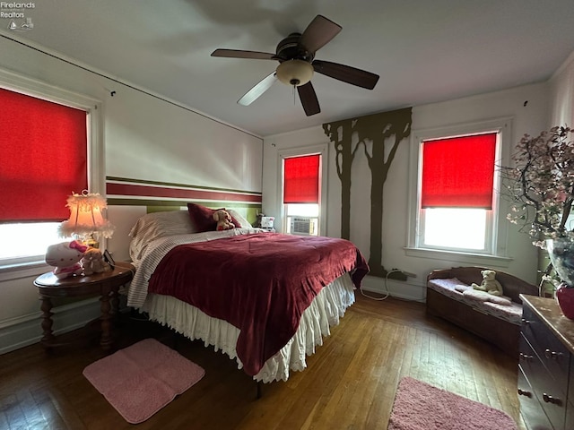 123 E Main, Norwalk, OH 44857 - bedroom with a ceiling fan, hardwood / wood-style floors, and multiple windows