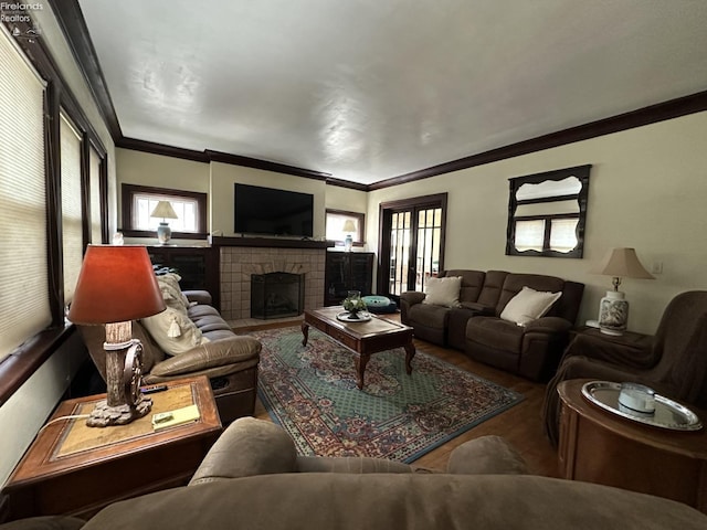 123 E Main, Norwalk, OH 44857 - living area with a tiled fireplace, wood finished floors, and crown molding