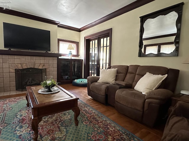 123 E Main, Norwalk, OH 44857 - living room with a tile fireplace, wood finished floors, and crown molding