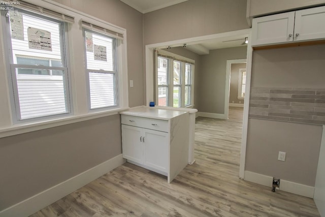 2615 Columbus Ave, Sandusky, OH 44870 - kitchen with baseboards, a peninsula, and light wood-style flooring