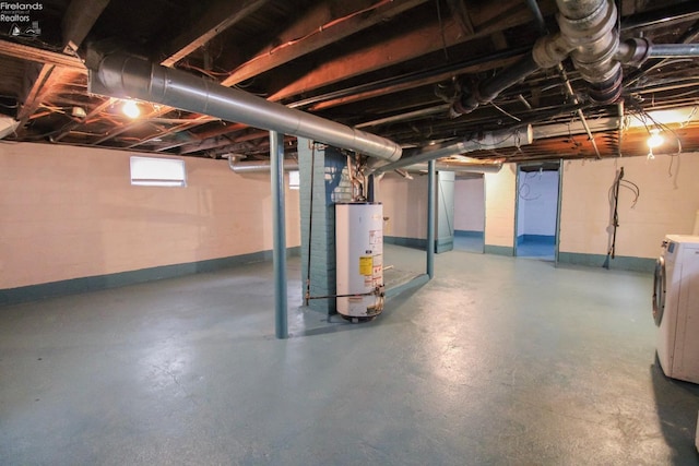 2615 Columbus Ave, Sandusky, OH 44870 - below grade area with water heater, washer / clothes dryer, and baseboards