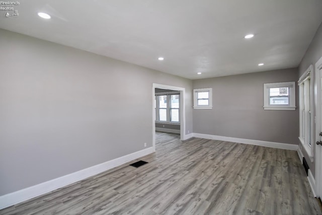 2615 Columbus Ave, Sandusky, OH 44870 - empty room featuring recessed lighting, visible vents, wood finished floors, and baseboards