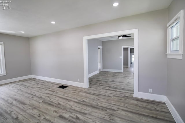2615 Columbus Ave, Sandusky, OH 44870 - unfurnished room featuring wood finished floors, recessed lighting, visible vents, and baseboards