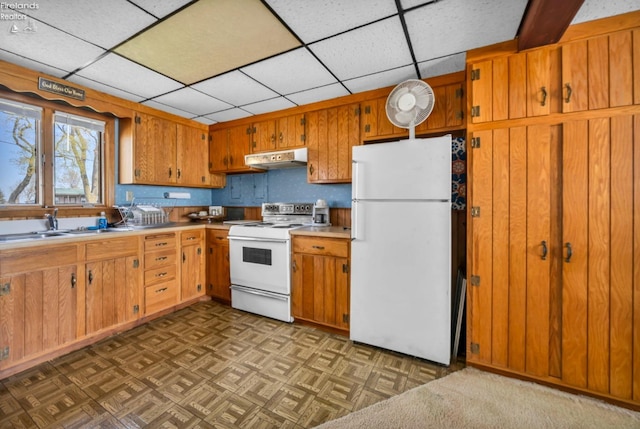 1270 Deist Rd, Middle Bass Island, OH 43446 - kitchen featuring a sink, white appliances, brown cabinetry, and under cabinet range hood