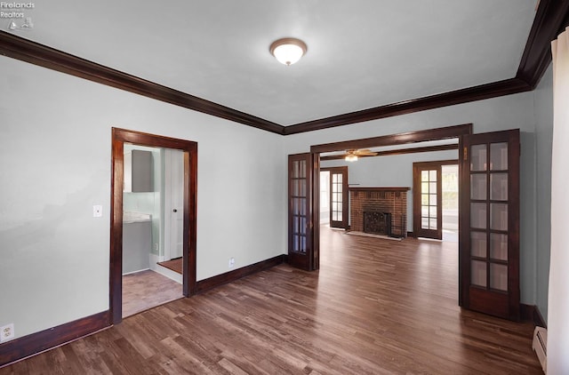 1507 S Lakeview Blvd, Lorain, OH 44052 - spare room with baseboards, ornamental molding, dark wood-style flooring, and french doors