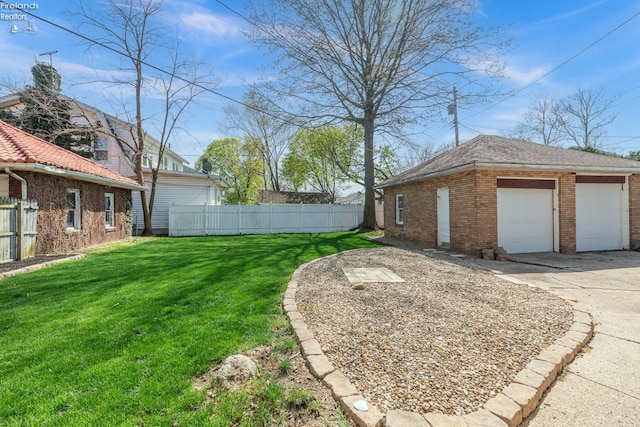 1507 S Lakeview Blvd, Lorain, OH 44052 - view of yard with an outbuilding, a garage, and fence