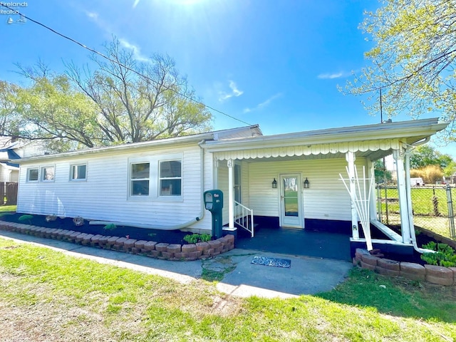 120 Mckim St, Bellevue, OH 44811 - view of front of house featuring fence and an attached carport