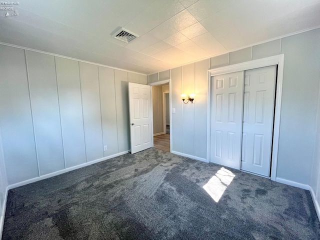 120 Mckim St, Bellevue, OH 44811 - unfurnished bedroom with visible vents, crown molding, baseboards, and carpet floors