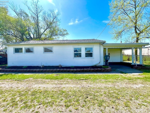 120 Mckim St, Bellevue, OH 44811 - view of side of property with a lawn and an attached carport