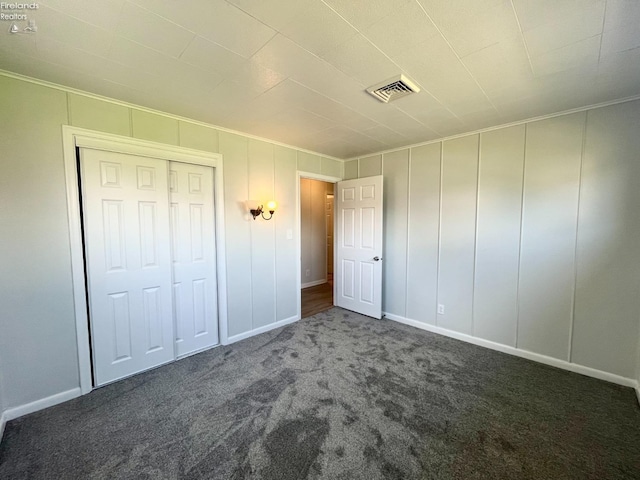 120 Mckim St, Bellevue, OH 44811 - unfurnished bedroom featuring a closet, crown molding, visible vents, carpet, and baseboards