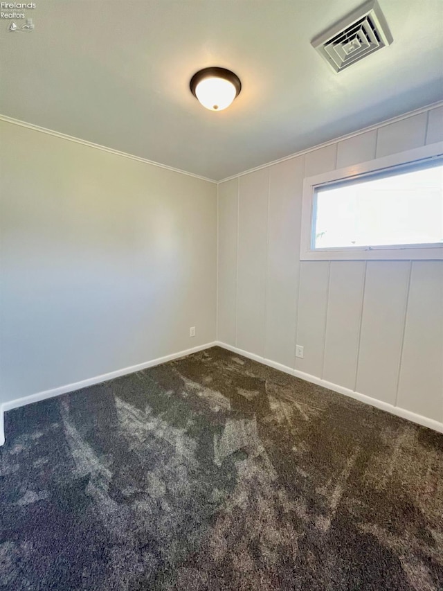 120 Mckim St, Bellevue, OH 44811 - carpeted spare room featuring crown molding, visible vents, and baseboards