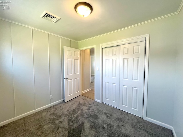 120 Mckim St, Bellevue, OH 44811 - unfurnished bedroom with visible vents, crown molding, and carpet