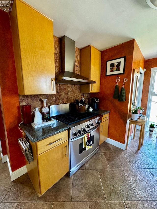 5106 Ottawa River Rd, Toledo, OH 43611 - kitchen featuring wall chimney exhaust hood, stainless steel range with gas stovetop, decorative backsplash, and baseboards