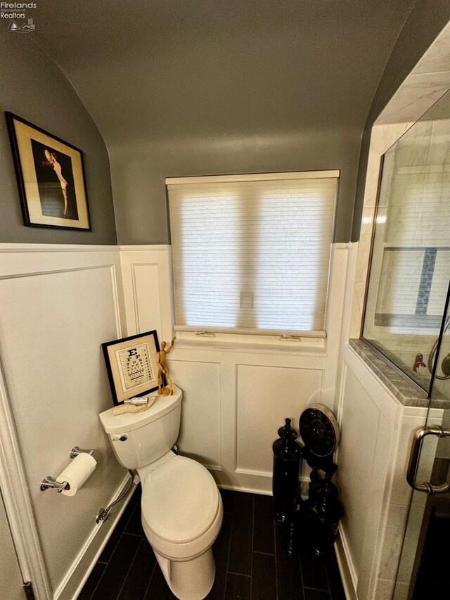 5106 Ottawa River Rd, Toledo, OH 43611 - full bath featuring a shower stall, wood tiled floor, toilet, a decorative wall, and wainscoting