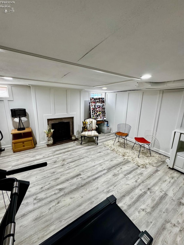 5106 Ottawa River Rd, Toledo, OH 43611 - interior space with wood finished floors, a decorative wall, and a fireplace