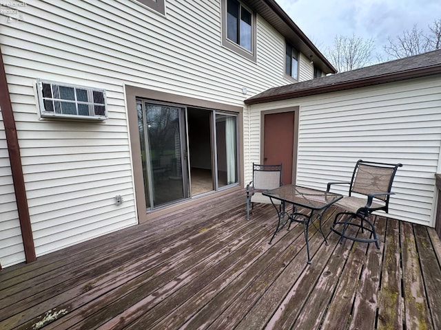 wooden deck featuring outdoor dining area