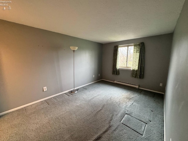 spare room with baseboards, carpet floors, and a baseboard radiator