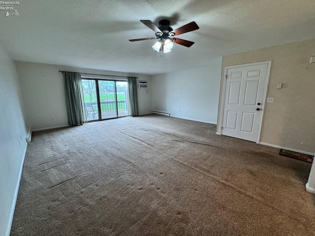 empty room with a baseboard heating unit, baseboards, carpet floors, a wall mounted AC, and a ceiling fan