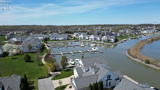 aerial view with a water view and a residential view