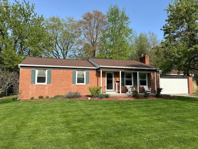ranch-style home with covered porch, a chimney, and a front yard