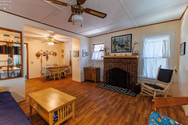 428 Cedar, Lakeside, OH 43440 - living room with ceiling fan, wood finished floors, and a brick fireplace