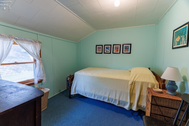 428 Cedar, Lakeside, OH 43440 - bedroom with carpet floors, lofted ceiling, and a decorative wall