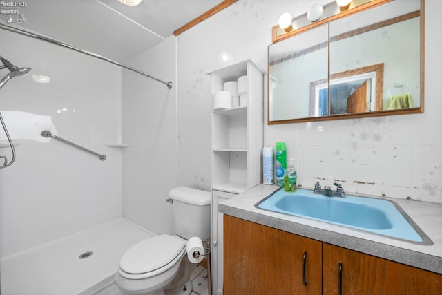 bathroom with vanity, a shower, and toilet