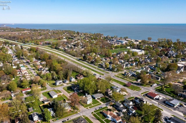 aerial view with a water view and a residential view